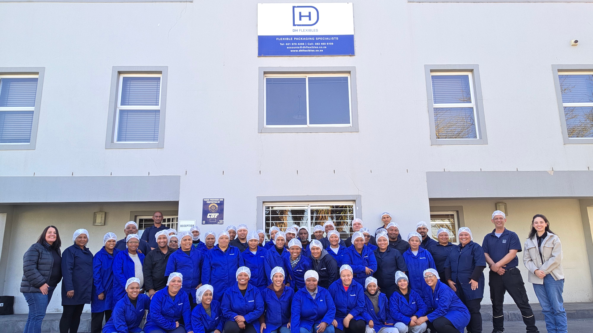 DH Flexibles team outside the factory